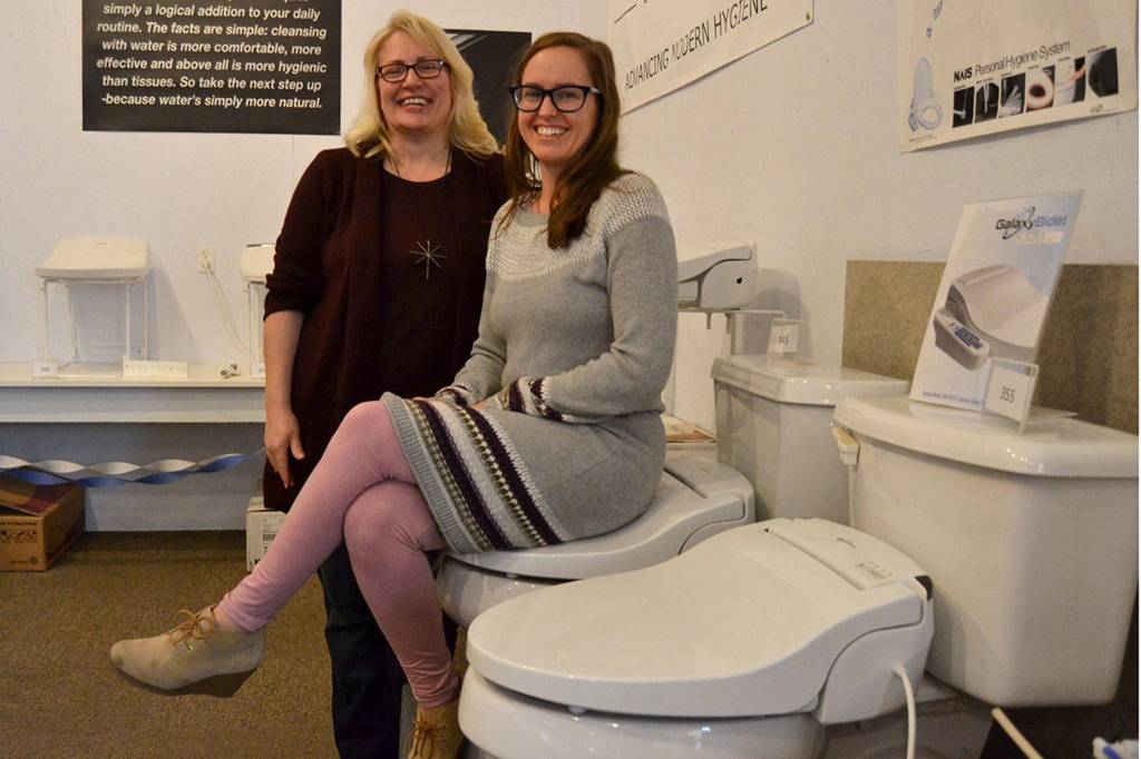 Josslyn Streett recently sold Clear Water Bidets to employee Sara Shearer in late September. The Carlsborg business primarily makes its sales online but does do sales and repairs in-house. Sequim Gazette photo by Matthew Nash