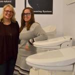 Josslyn Streett recently sold Clear Water Bidets to employee Sara Shearer in late September. The Carlsborg business primarily makes its sales online but does do sales and repairs in-house. Sequim Gazette photo by Matthew Nash