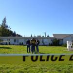 Detectives with the Olympic Peninsula Narcotics Enforcement Team (OPNET) talk outside of the Sunbelt Apartments on Oct. 9, the afternoon after a Sequim woman allegedly tried to kill a fellow resident in the complex. Sequim Gazette photo by Matthew Nash