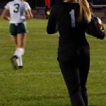 Sequim Wolves goalkeeper Olivia Hare (right, 1) strides forward after collecting the ball in front of goal early in the first half of their win against Port Angeles on Oct. 8. Hare made several big saves during regulation, then stopped all three penalties she faced from the Roughriders in the tiebreaking shootout to secure a big win for the Wolves and the first loss of the season for PA. Sequim Gazette photo by Conor Dowley