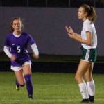 Port Angeles Roughriders forward Hannah Reetz (right) shows frustration after Mary McAleer (left, 5) clears a pass intended for her in front of the Sequim Wolves goal on Oct. 8. Reetz and star forward Millie Long struggled for quality service into the final third because of the Wolves game plan in their 2-1 shootout win. Sequim Gazette photo by Conor Dowley