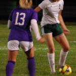 Port Angeles Roughriders midfielder Bailee Larson (right) looks to play the ball as Sequim Wolves midfielder Natalya James closes in during the first half of Sequims 2-1 shootout win on Oct. 8. Sequim Gazette photo by Conor Dowley