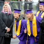 With counselors Melee Vandervelde and Erin Fox and fellow grad-to-be Tyler Smith looking on, Tristan Dodson and Jorden Reed  along with about 190 of their fellow Sequim high School seniors  gear up to graduate on June 8, 2018. The photo earned earned Sequim Gazette editor Michael Dashiell a first place in the Color Feature Photo category at the the Washington Newspaper Publishers Associations 2019 Better Newspaper Contest. Sequim Gazette photo by Michael Dashiell