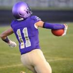 Sequim junior wide receiver Michael Young celebrates as he crosses the goal line to score a touchdown on the Wolves first drive of the game against the Olympic Trojans on Oct. 11. Sequim would go on to win the game 37-14, with Young adding a second receiving touchdown and a key interception on defense. Sequim Gazette photo by Conor Dowley