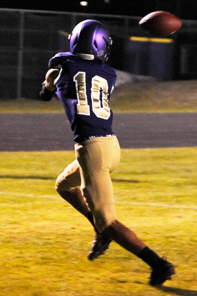 Junior wide receiver Garret Hoesel sets up to catch a 2-point conversion throw in the second quarter of the Sequim Wolves 37-14 win over the Olympic Trojans on Oct. 11. Hoesel only had one official reception on the night, but had a 59 yard interception return for a touchdown in the fourth quarter. Sequim Gazette photo by Conor Dowley