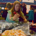 Ayla Smith, a club member at the Boys & Girls Club, makes buttons for the Sequim clubs Halloween event last year. The event continues this year from 6-9 p.m. Saturday, Oct. 26. Sequim Gazette file photo by Matthew Nash
