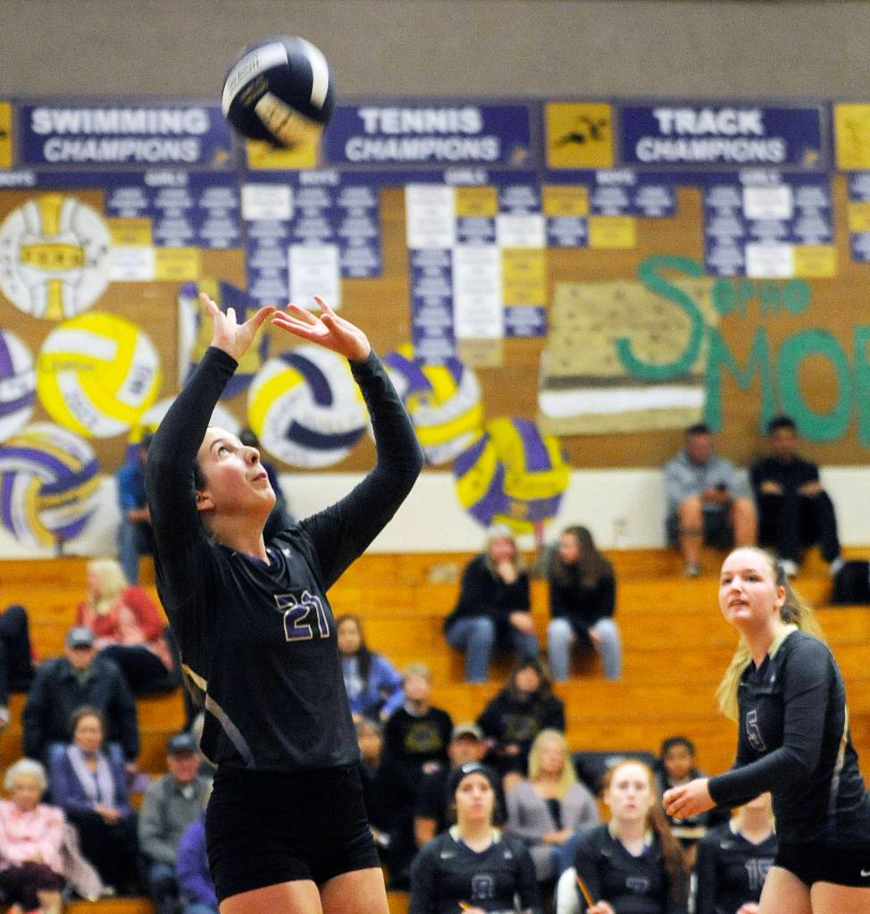 Sequims Kalli Wiker, left, looks to set a teammate as Amanda Weller looks on. Wiker and Weller helped the Wolves knock off Olympic in five games on Oct. 15. Sequim Gazette photo by Michael Dashiell