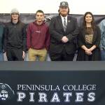 From left, Peninsula College esports coach Charlie Morrow stands with Overwatch team members Cameron Fouts, Levi Foy, Mike Roggenbuck, Ashley Frantz and Ted Cosmez. Not pictured are team members Katelyn Simmons and Damien Cundiff. Submitted photo