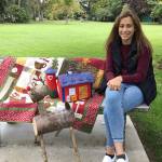 Jessica Dietzman, P.E.O. Chapter JC Star Scholarship nominee, admires items slated for the Nov. 2 P.E.O. Holiday Bazaar silent auction. Photo by Kathy Cox