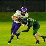Sequim receiver Isaiah Moore, left, looks to shrug off a tackle by Port Angeles defensive back Miles Van Sant in the first half of the Wolves 26-0 win at Port Angeles on Oct. 18. Sequim Gazette photo by Michael Dashiell