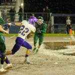 Sequim running back Walker Ward bursts through the line for a score in the second quarter of the Wolves big win at Port Angeles on Oct. 18. Sequim Gazette photo by Michael Dashiell