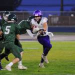 Sequim receiver Michael Young looks for running room in the first quarter of the Wolves Olympic League match-up at Port Angeles on Oct. 18. Sequim Gazette photo by Michael Dashiell