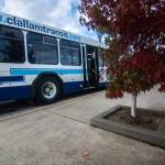 A bus full of jurors deciding whether Clallam Transit System is responsible for the injuries of a Sequim women stops at the Sequim Transit Center to see the tree box Virginia Moon tripped over. (Jesse Major/Peninsula Daily News)