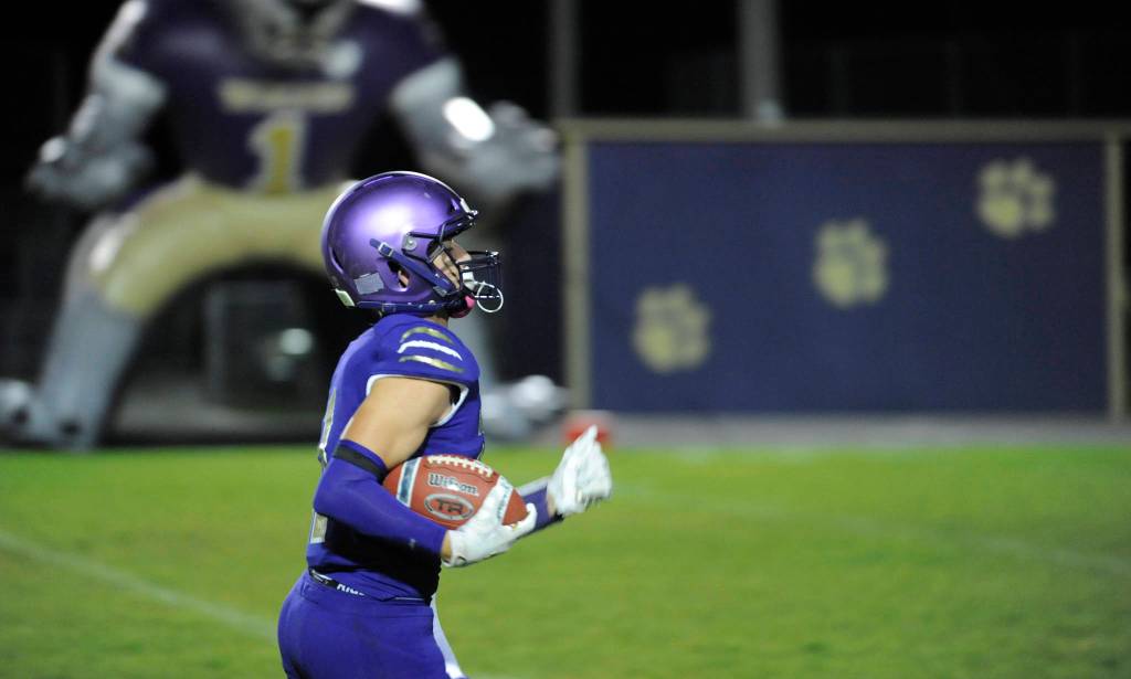 Sequim junior receiver Michael Young races 70 yards for a touchdown as the Wolves edge the Grizzlies 14-12 on Oct. 25. Sequim Gazette photo by Michael Dashiell
