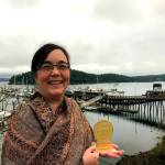 Grace Kendall, Peninsula Colleges Director of Marketing, receives a gold medallion award at the recent District 7 National Council for Marketing and Public Relations Conference, held in Friday Harbor. Photo courtesy of Peninsula College