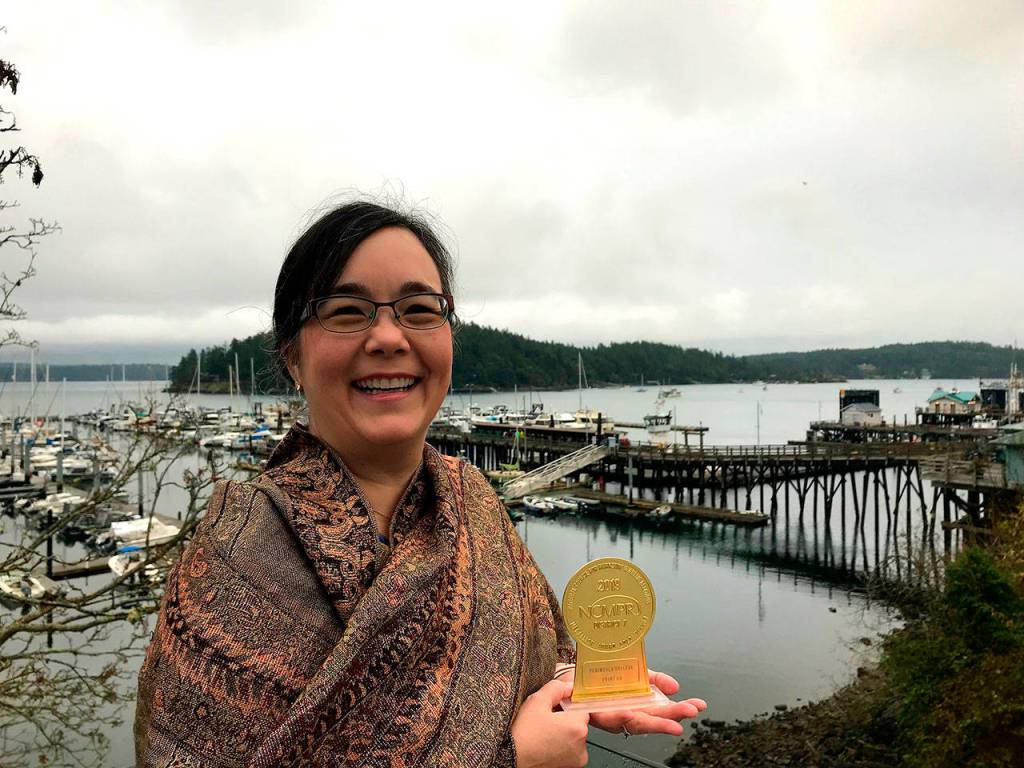 Grace Kendall, Peninsula Colleges Director of Marketing, receives a gold medallion award at the recent District 7 National Council for Marketing and Public Relations Conference, held in Friday Harbor. Photo courtesy of Peninsula College