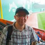 Me, next to the Green Monster at Fenway in July. Photo by Michael Dashiell