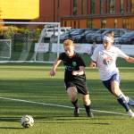 Mike McAleer, right, vies for the ball against a Club Three Rivers defender in a Nov. 2 match-up in Port Angeles. McAleer took one on the chin (literally); a high kick from a Club Three Rivers player drew a red card and drew blood, temporarily putting the Sequim High senior out of the game. Sequim Gazette photo by Michael Dashiell