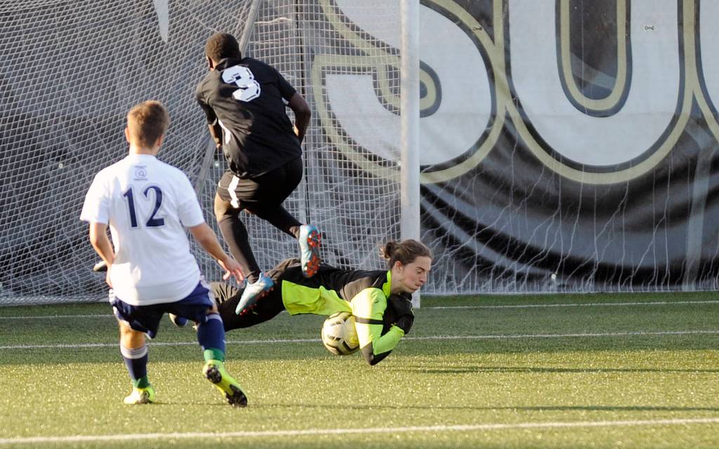 Sequim High senior goalkeeper Navy Thomas-Brenske makes a diving stop against Club Three Rivers (Pasco) on Nov. 2. Thomas-Brenske has played on Storm King teams for eight years. Sequim Gazette photos by Michael Dashiell