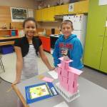 Helen Haller fourth graders Mia Peralta and Nolan Bacchus build an index card tower that is able to support the weight of the object placed atop. Photo by Kieth Lee