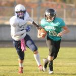 Sequim Timberwolf Easton Munger, right, looks for running room as he and Sequim take on Stevens (Port Angeles) on Oct. 30. Sequim Gazette photo by Michael Dashiell