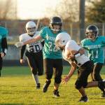 Sequims Dylan Allen (22) and teammates corral a Stevens (Port Angeles) player in an Oct. 30 league match-up in Sequim. Sequim Gazette photo by Michael Dashiell