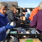 Nancy Bolen with Trinity United Methodist Church helps fellow church members sort food for the Boo Hunger food drive on Halloween morning. She and many other volunteers made quick work of sorting non-perishable foods like peanut butter.