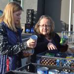 JoNell Hill, coordinator of the Boo Hunger food drive, chats with Lelia Nichols with Trinity United Methodist Church as they sort food on Halloween morning. Locals donated about 4,500 pounds of food this year. Sequim Gazette photos by Matthew Nash