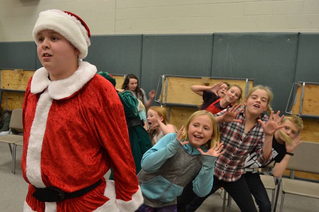 Santa Claus (Brock Hope) listens to his elves sing at a recent practice for Elf The Musical Jr. Sequim Gazette photo by Matthew Nash
