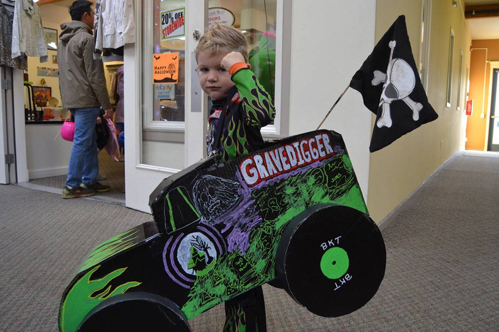 Obi Galvin, 3, revs his engines and flexes his muscles while driving Grave Digger on Halloween Obis family served as his pit crew and said hes a big monster truck fan.