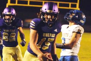 Taig Wiker celebrates as he crosses the goal line for his fourth rushing touchdown of the night in the Sequim Wolves 36-21 win against the Bremerton Knights on Nov. 1. Sequim Gazette photo by Conor Dowley