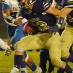 Walker Ward breaks through the line during the third quarter of the Sequim Wolves 36-21 win over the Bremerton Knights on Nov. 1. Ward was a reliable workhorse on the night, with 122 yards on 24 carries, and picking up several big first downs to keep drives moving. Sequim Gazette photo by Conor Dowley