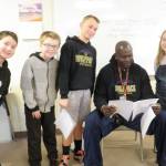 Fifth-graders at Helen Haller take a written fitness test as part of state learning requirements for physical education. From Meredith Vincents class are, from left, Gage Reynolds, Colby Verdu, Ryan Weidman, P.E. teacher Joclin Julmist and Leila Sanderson. Photo by Patsene Dashiell
