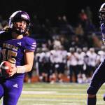 Sequim Wolves quarterback Taig Wiker celebrates after scoring a rushing touchdown in the second quarter of the Wolves 37-21 district playoff win over the River Ridge Hawks on Nov. 8. Wiker threw for two touchdowns and ran for two more on the night to help lead to the Wolves to a second straight state playoff berth.