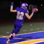 Sequim Wolves running back Walker Ward celebrates after scoring a touchdown off a screen pass in the second quarter of the Wolves 37-21 district playoff win over the River Ridge Hawks on Nov. 8. Ward had 164 yards rushing and one touchdown on 26 carries, plus two receptions for 40 yards and another touchdown on the night. Sequim Gazette photo by Conor Dowley