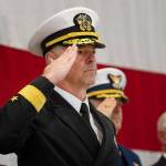 Rear Adm. Christopher Scotty Gray of the U.S. Navy salutes during the national anthem at the Veterans Day ceremony at U.S. Coast Guard Air Station/Sector Field Office Port Angeles on Monday. (Jesse Major/Peninsula Daily News)