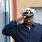 Lt. Cmdr. Harold Piper salutes during the national anthem at the Veterans Day ceremony at U.S. Coast Guard Air Station/Sector Field Office Port Angeles on Monday. (Jesse Major/Peninsula Daily News)