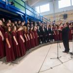 Rear Adm. Christopher Scotty Gray of the U.S. Navy reprents World War II veteran William Payne, of the Merchant Marines, with a quilt during the Veterans Day ceremonyon Monday.