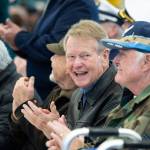 Clallam County Commissioner Randy Johnson applauds as veterans are recognized during the Veterans Day ceremony at U.S. Coast Guard Air Station/Sector Field Office Port Angeles on Monday. (Jesse Major/Peninsula Daily News)