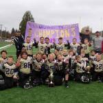 One proud (wolf)pack: The Sequim Wolf Pack junior varsity squad, a team of third- and fourth-graders, celebrates a 13-12 win against the PA Future Roughriders in Forks on Nov. 9. Sequim quarterback Kaden Miller threw two touchdown passes, both to Nolan Bacchus. Miller also ran in an extra-point-after-touchdown to give Sequim the decisive one-point win. Submitted photo