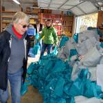 Food bank volunteer Isabelle Dunlop places two of the 800 bags for Thanksgiving meals at the Sequim Food Bank. Sequim Gazette photo by Matthew Nash