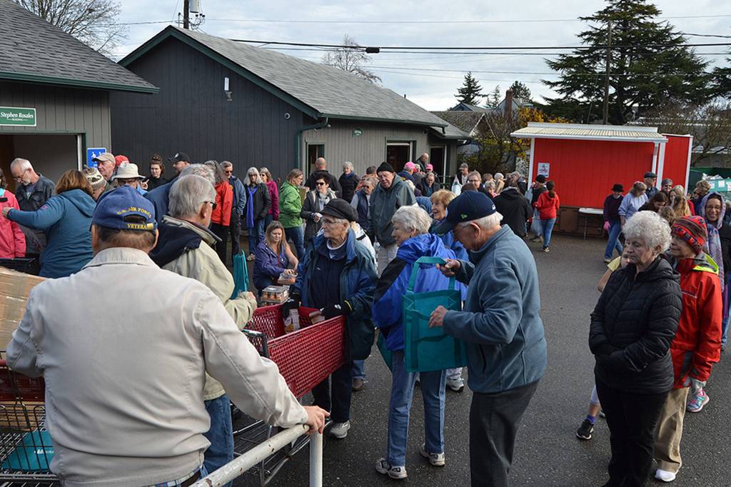 Dozens of volunteers made short work of preparing 800 bags of Thanksgiving meals at the Sequim Food Bank on Nov. 19. Sequim Gazette photo by Matthew Nash
