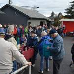 Volunteers stuff 800 bags for food bank’s Thanksgiving