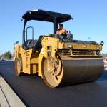 Eugina Haltunnen with Lakeside Industries drives a CB64 roller on Nov. 22 to smooth out the first portion of asphalt on West Fir Street in front of Helen Haller Elementary. Sequim Gazette photo by Matthew Nash