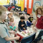 Kindergarteners Corliss Hill, left, and Mia Moose practice methods for sharing a toy for their class at Helen Haller Elementary School. They are encouraged to use phrases such as May I?, Thank you and Youre welcome in their dialogue. Photo by Patsene Dashiell