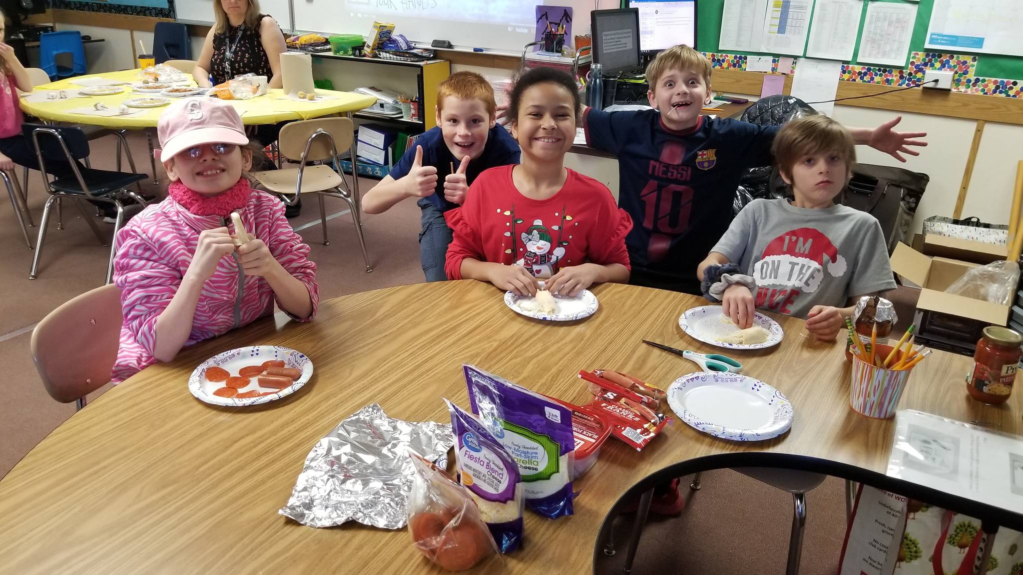 As part of Fun Friday, students in Resource Room for grades 3-5 chose baking and decorating edible items with teachers and para educators. Pictured, from left, are Katherine Chaussee, Arvids Prorok, Carolina Peralta-Castro, Gabriel Francis, and Daymian Francis. Photo by Melissa Sagara
