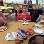 As part of Fun Friday, students in Resource Room for grades 3-5 chose baking and decorating edible items with teachers and para educators. Pictured, from left, are Katherine Chaussee, Arvids Prorok, Carolina Peralta-Castro, Gabriel Francis, and Daymian Francis. Photo by Melissa Sagara