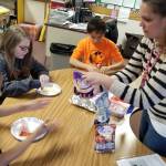 As part of Fun Friday, students in Resource Room for grades 3-5 chose baking and decorating edible items with teachers and para educators. Pictured, from left,Urijah Marchbanks, Clinton Cosio, Jesse Nash and teacher Heather Riley. Photo by Melissa Sagara