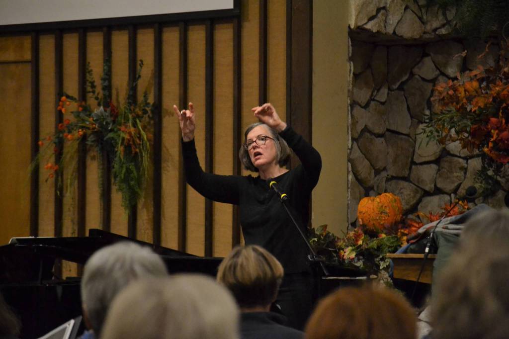 Above, Director Louise Pluymen returns to lead the Sequim Community Christmas Chorus Dec. 6-8 in the Sequim Seventh-day Adventist Church. Her husband Rob is one of 70 singers to participate in the non-denominational group. Right, Rob Pluymen, a retired professional singer in Europe, sings two solos of Ave Maria and Panis Angelicus.