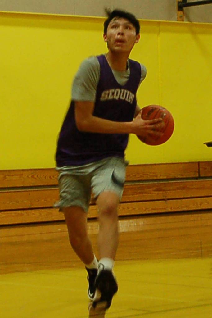 Isaiah Moore looks to score during a pre-season practice for the Sequim Wolves boys basketball team on Nov. 21. Sequim Gazette photo by Conor Dowley